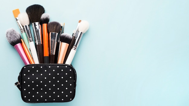 Free photo small bag with makeup brushes