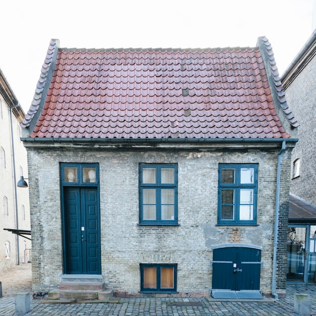 Small brick house with tiled roof