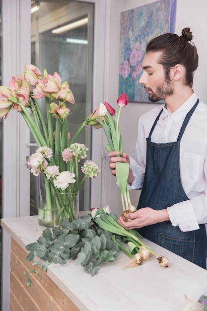 Small business. Male florist in flower shop.