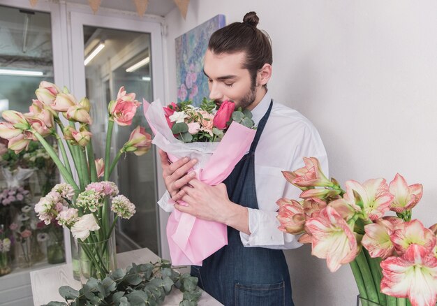 Small business. Male florist in flower shop.