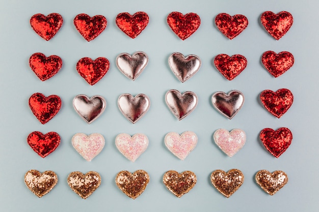 Free Photo small different shiny hearts on table