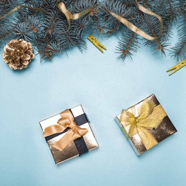 Free Photo small gift boxes with fir tree branches on table