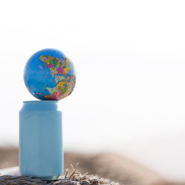 Small globe on top of bottle