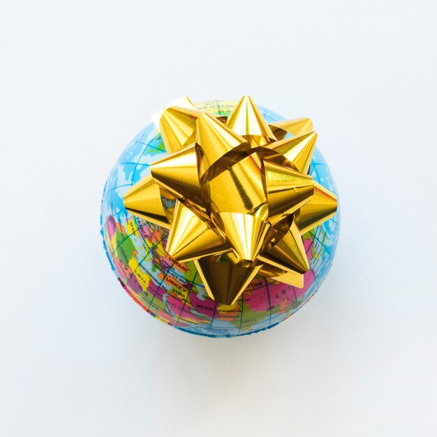 Small globe with yellow bow 