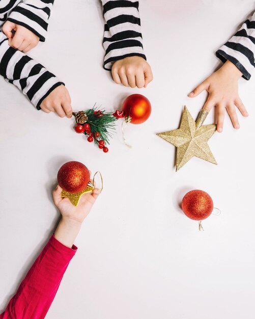 Small hands and christmas ball