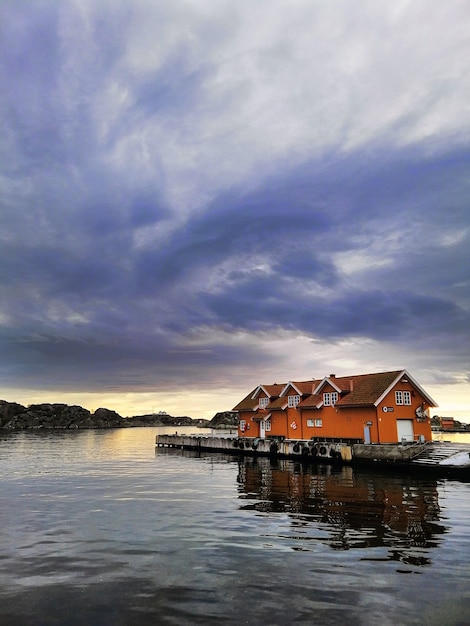 Free Photo small houses on the dock under cloudy sky