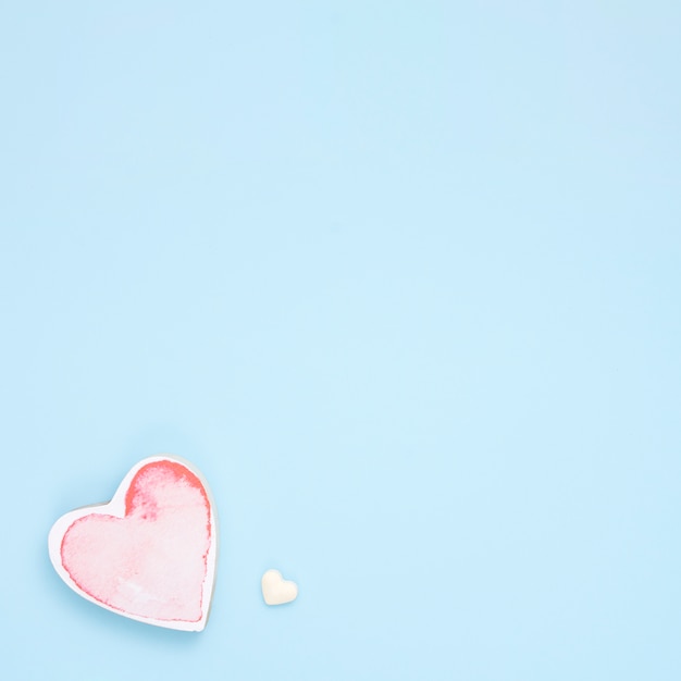 Small red heart on blue table