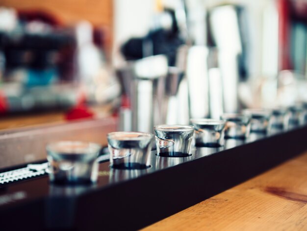 Small shot glasses on bar counter