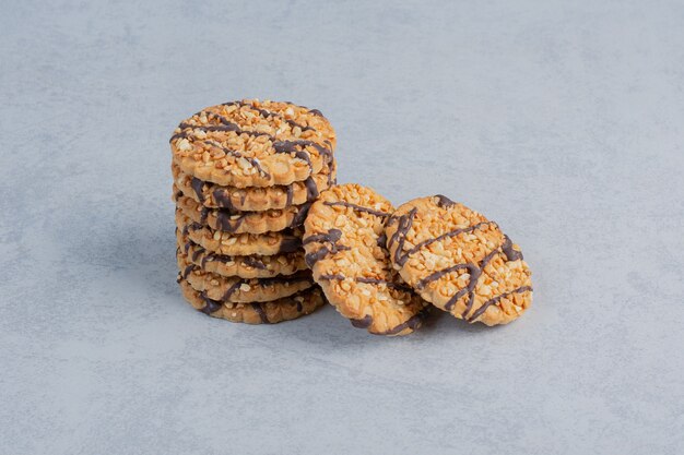 A small stack of cookies on marble surface