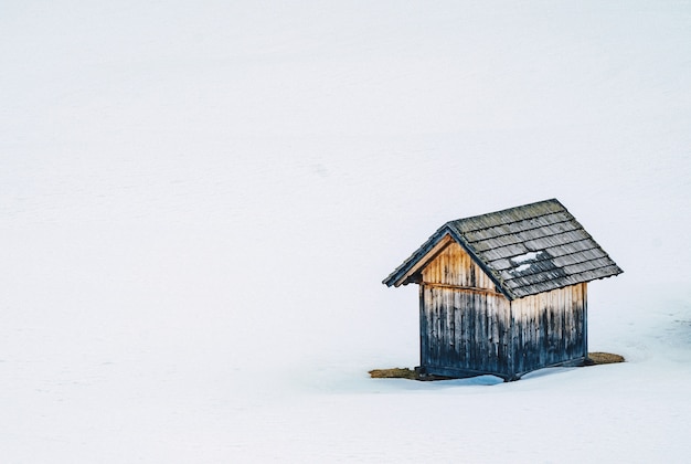 Free Photo small wooden barn in a snowy field