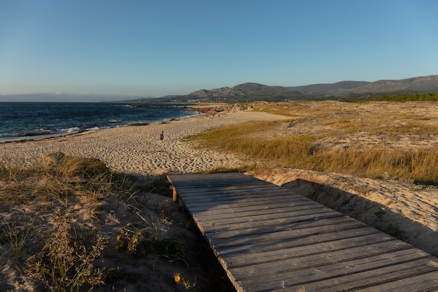 A small wooden bridge at the beach