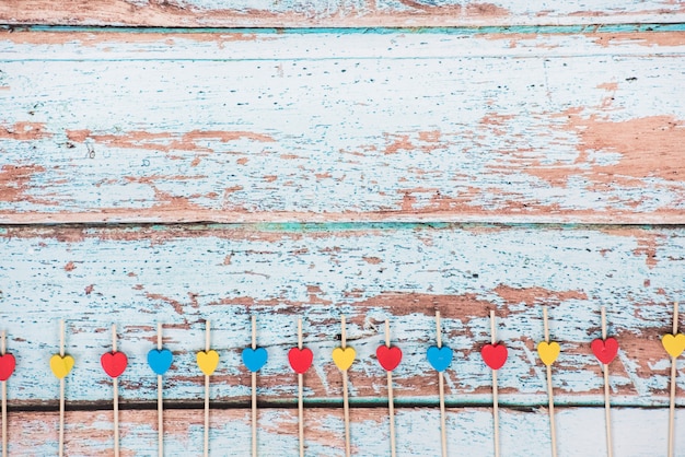 Free Photo small wooden hearts on sticks on table