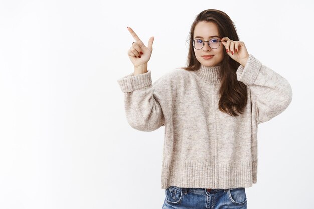 Smart and confident woman offering perfect product knowing what talking about standing like professional