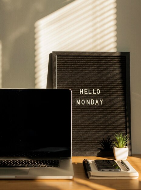 Smartphone and laptop on desk