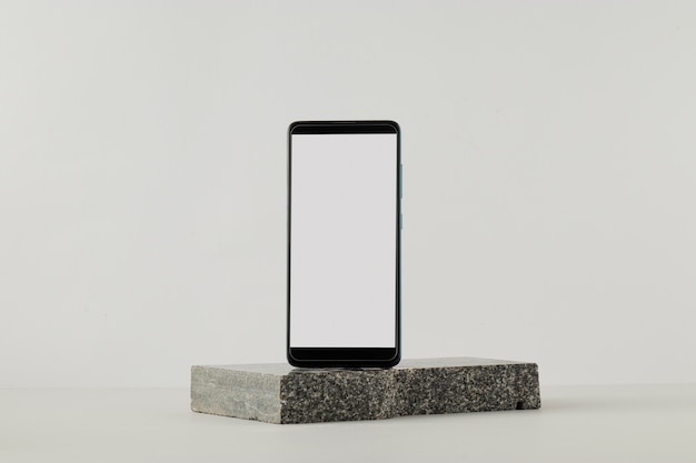 Smartphone minimal display on rock