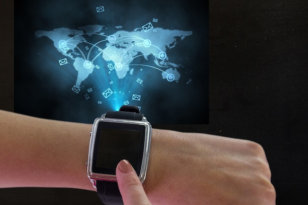 Free Photo smartwatch with message icons and a world map