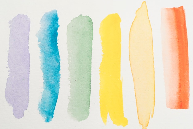 Smears of colorful watercolor on paper