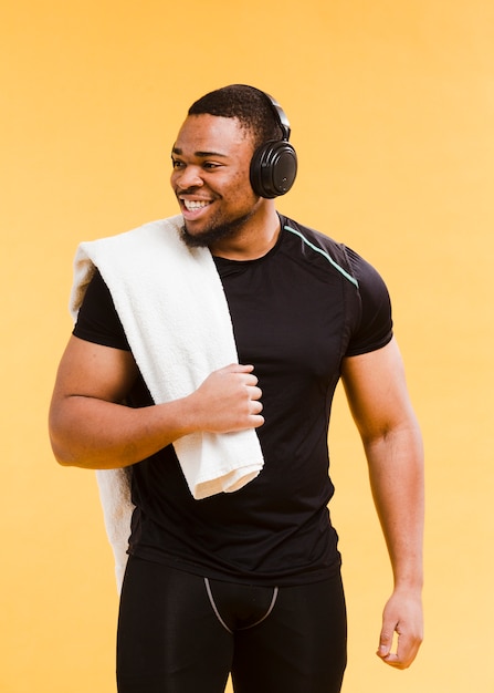 Smiley athletic man in gym outfit