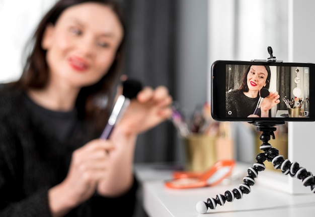 Smiley blurred woman holding brush