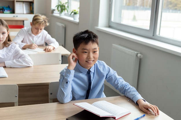 Smiley boy at school high angle