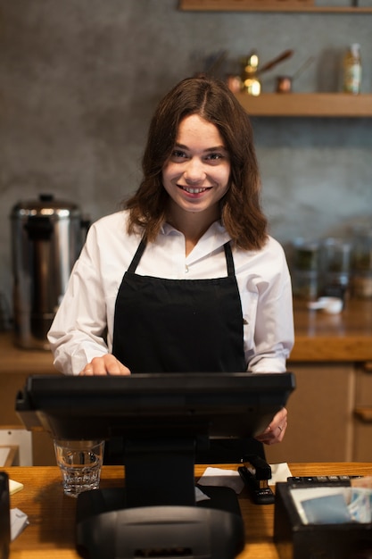 Smiley business woman working at cashier