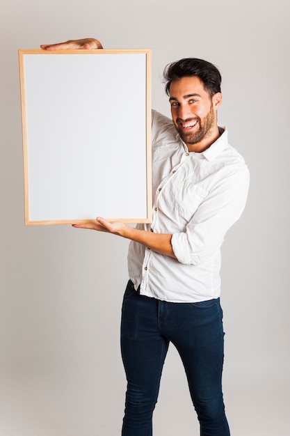 Free photo smiley businessman with whiteboard