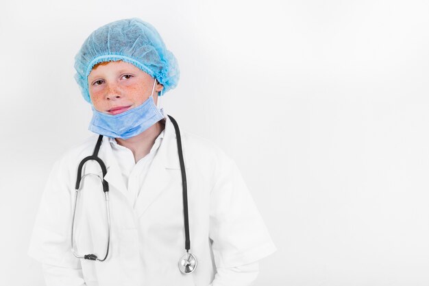 Smiley child with hair net and stethoscope