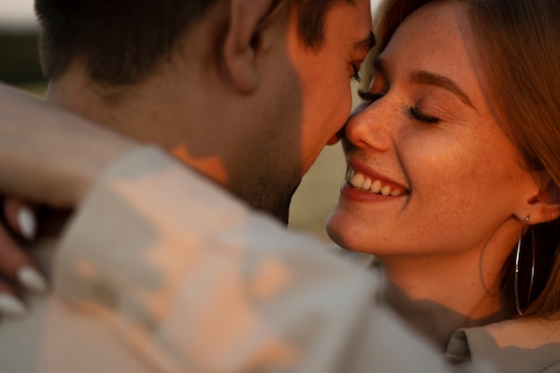 Smiley couple being in love side view