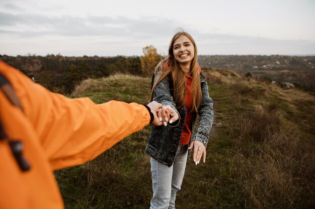 Free Photo smiley couple enjoying a road trip together