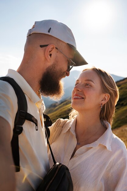 Smiley couple taking selfie medium shot