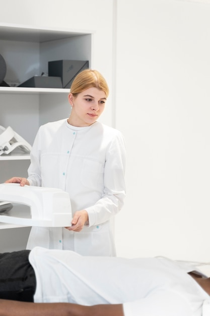 Free Photo smiley doctor giving ct scan to patient