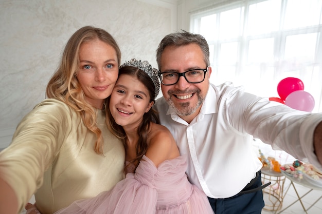 Smiley family taking selfie front view