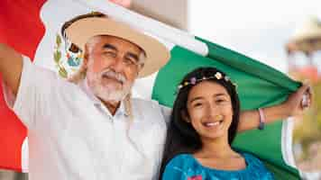 Free photo smiley family with mexican flag front view