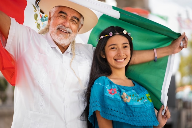 Smiley family with mexican flag medium shot