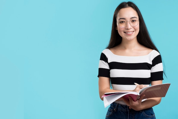 Smiley female holding book