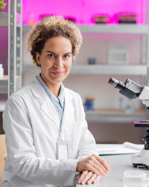 Smiley female researcher in the laboratory