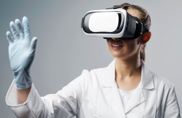 Smiley female researcher using a virtual reality headset