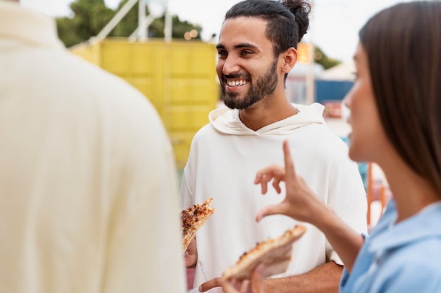 Smiley friends at food festival side view