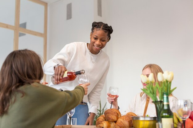 Smiley friends having a glass of wine