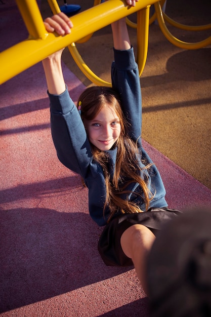 Free photo smiley girl having fun at the playground