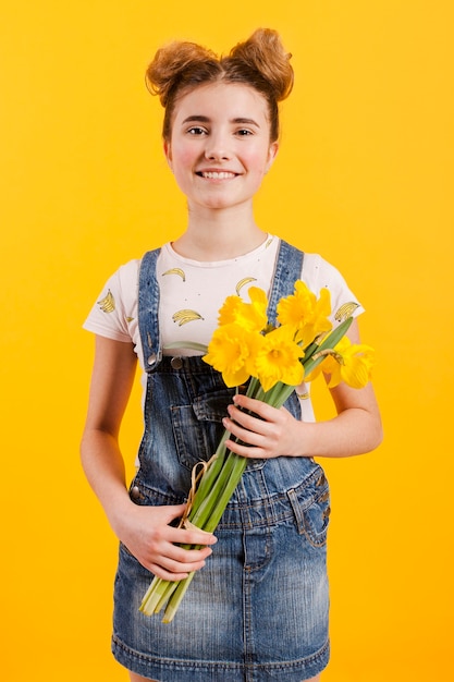 Smiley girl holding flowers