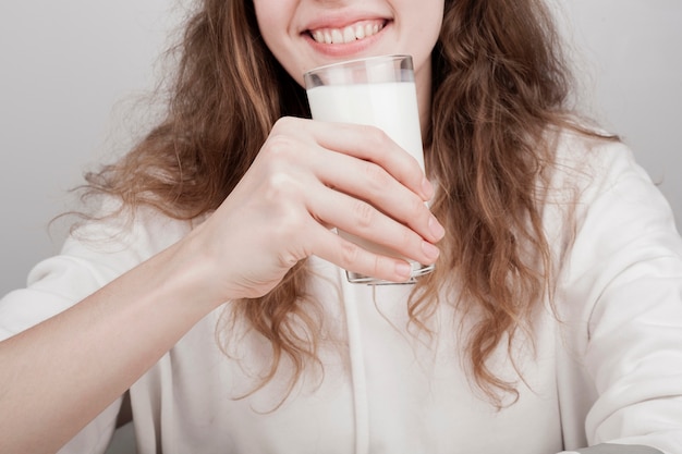 Smiley girl wanting to drink some milk