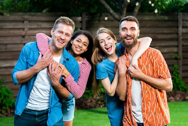 Smiley group of friends looking at camera