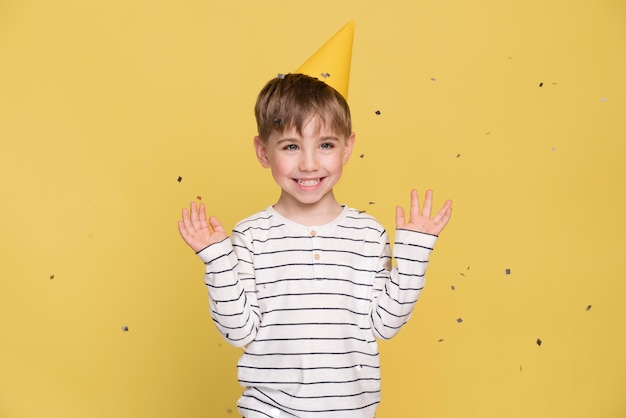 Free photo smiley little boy isolated on yellow