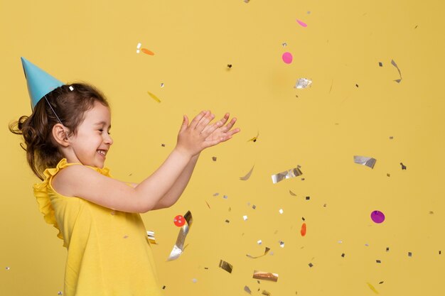 Free Photo smiley little girl celebrating a birthday