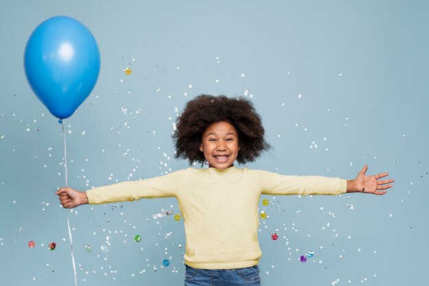 Smiley little girl celebrating her birthday