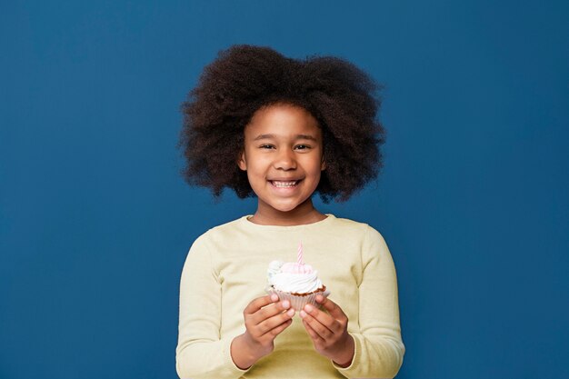 Smiley little girl celebrating her birthday