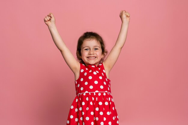 Smiley little girl in a red dress