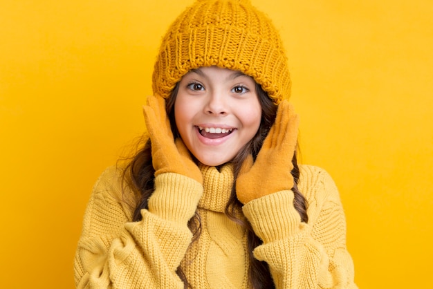 Smiley little girl wearing winter clothing