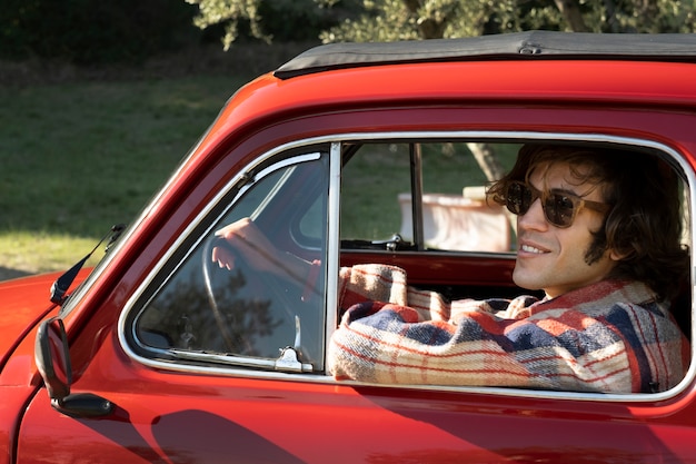 Smiley man driving car close up